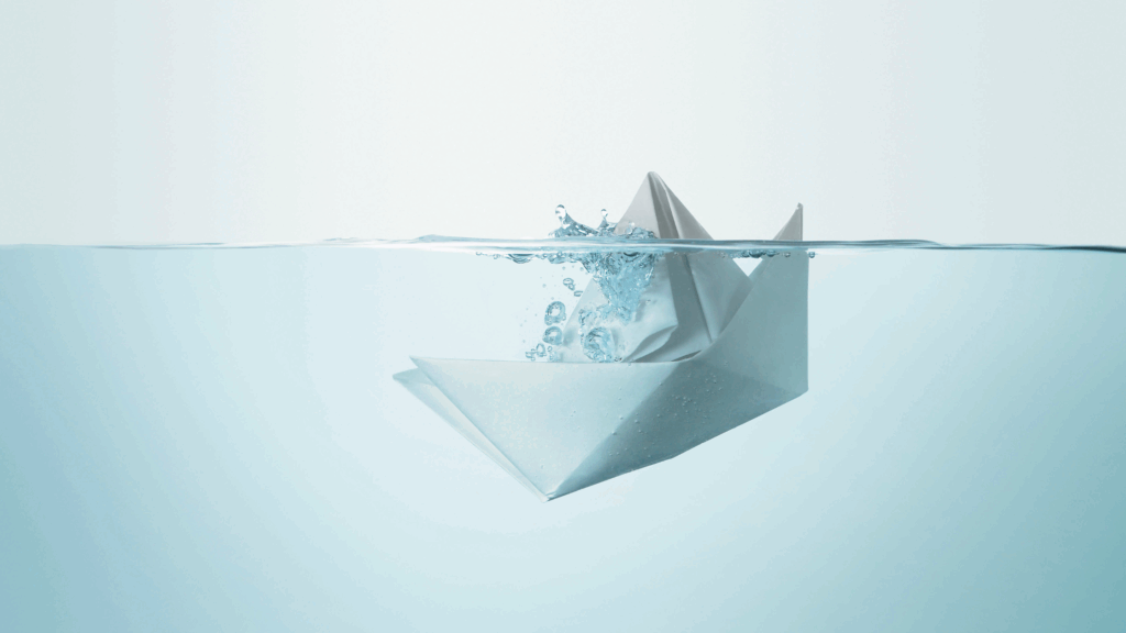 Image of a paper boat sinking