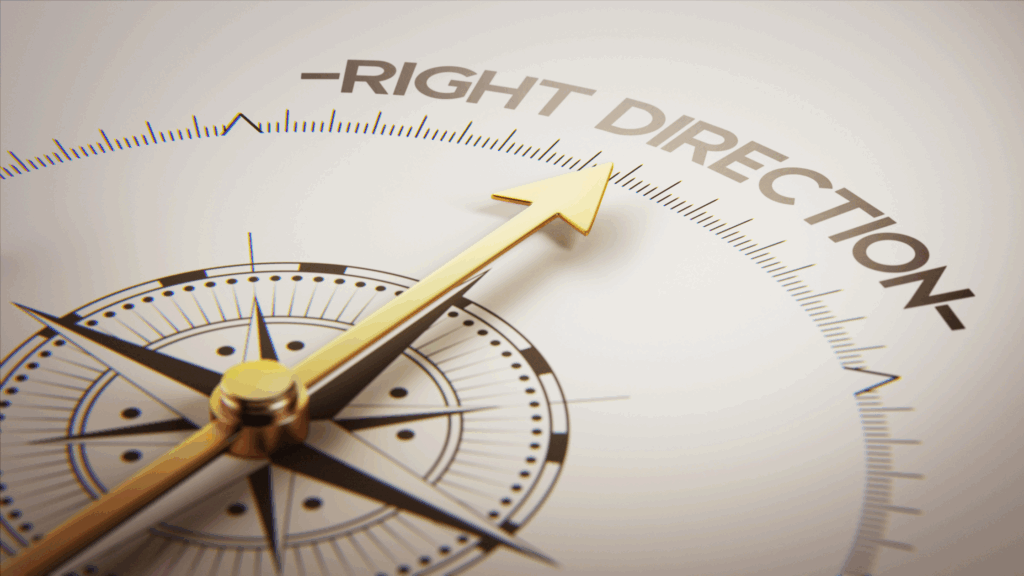 Image of a compass pointing to the words right direction