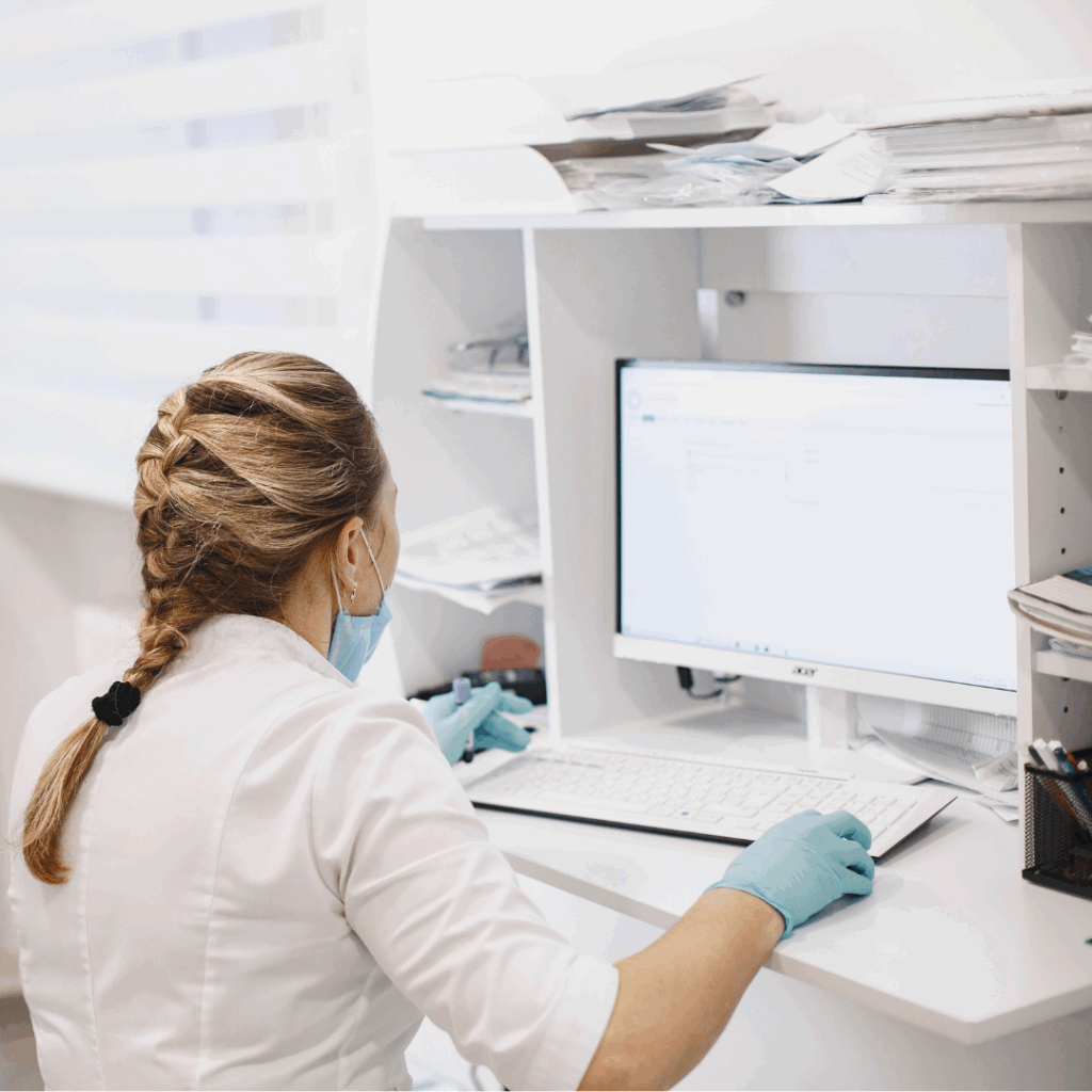 Image of a healthcare professional looking at a computer monitor