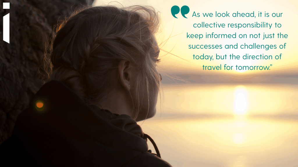 Image of a young woman looking out towards the horizon at a sunset