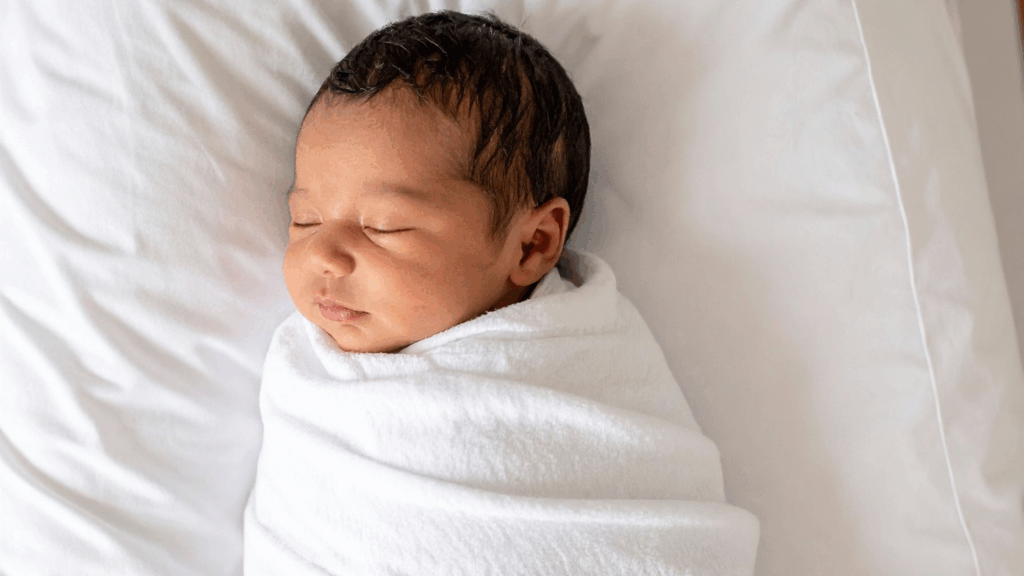 Image of a newborn baby swaddled in a blanket