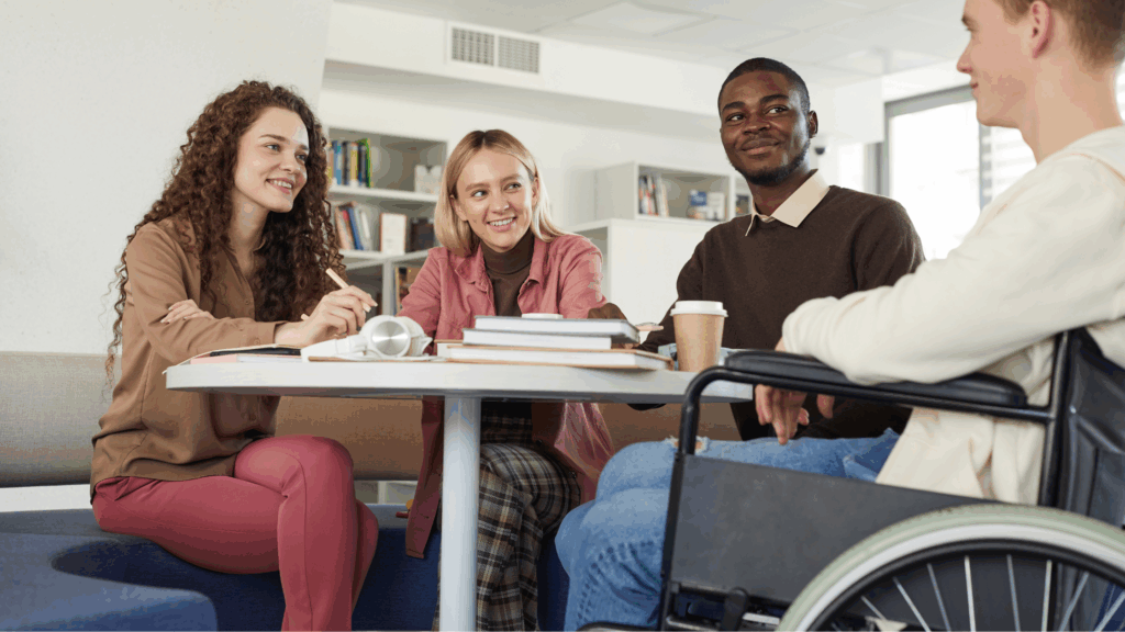 A photo of a group of young people sitting round a table