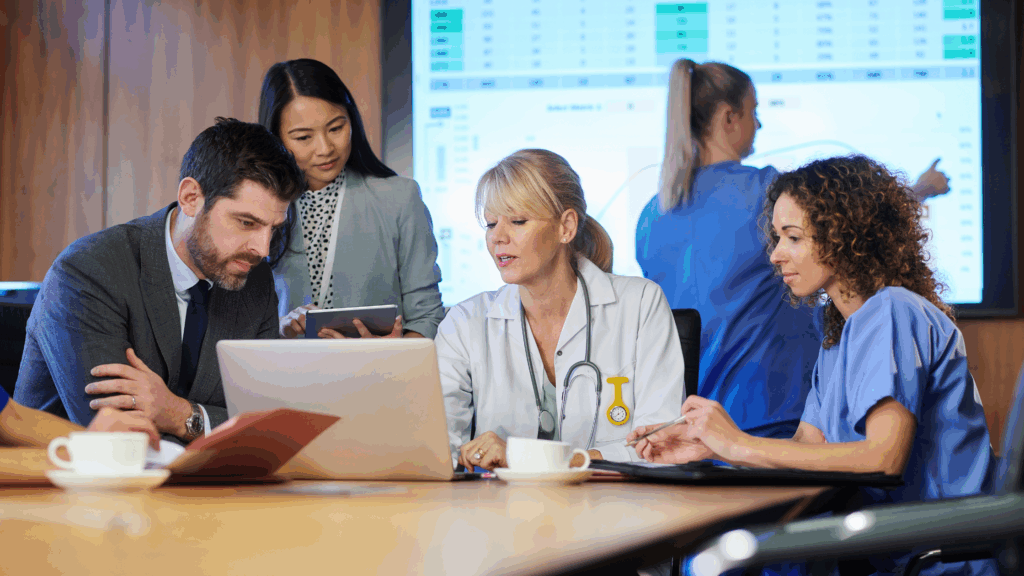 Image of medical professionals talking at a table