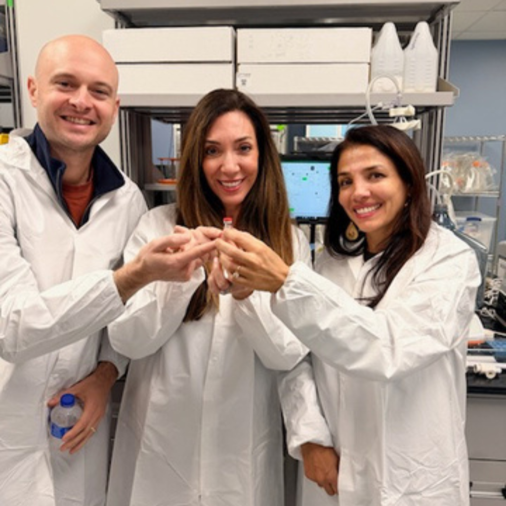 Holding the vial that the FOXG1 gene theory will be in while touring the Charles River Laboratories CDMO manufacturing facility (Ryan Phillips, Nicole Johnson and Nasha Fitter)