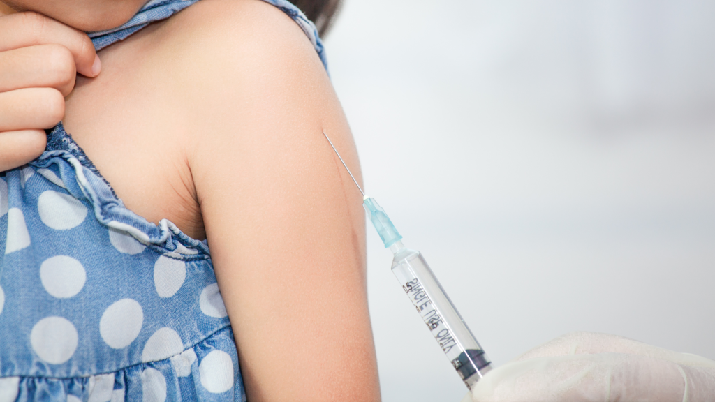 Photo of a child receiving an injection