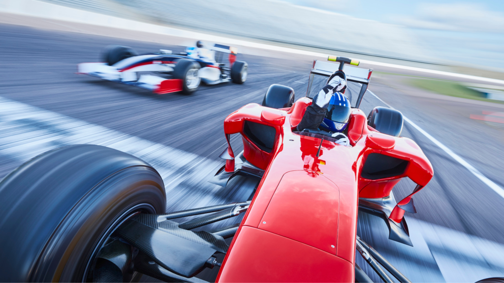 Photo of two formula 1 racing cars on a track