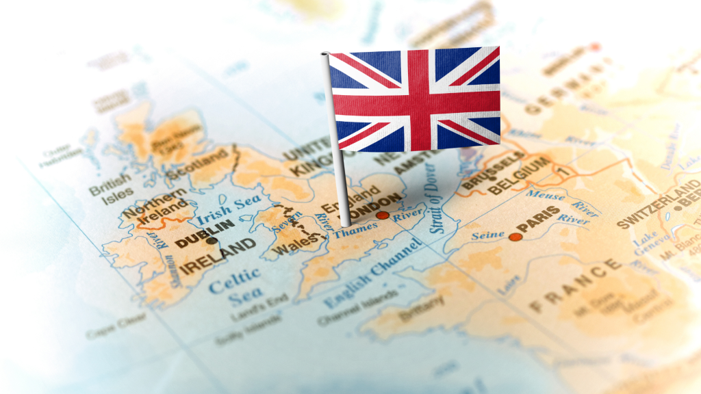 Photo of a map of the UK with a small UK flag pinned to it