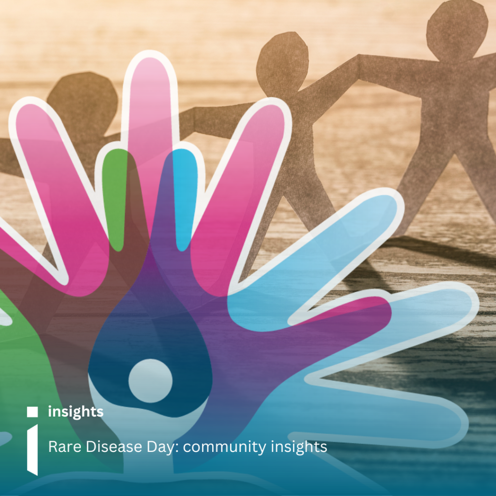 Photo of paper people holding hands with the Rare Disease Day logo in front