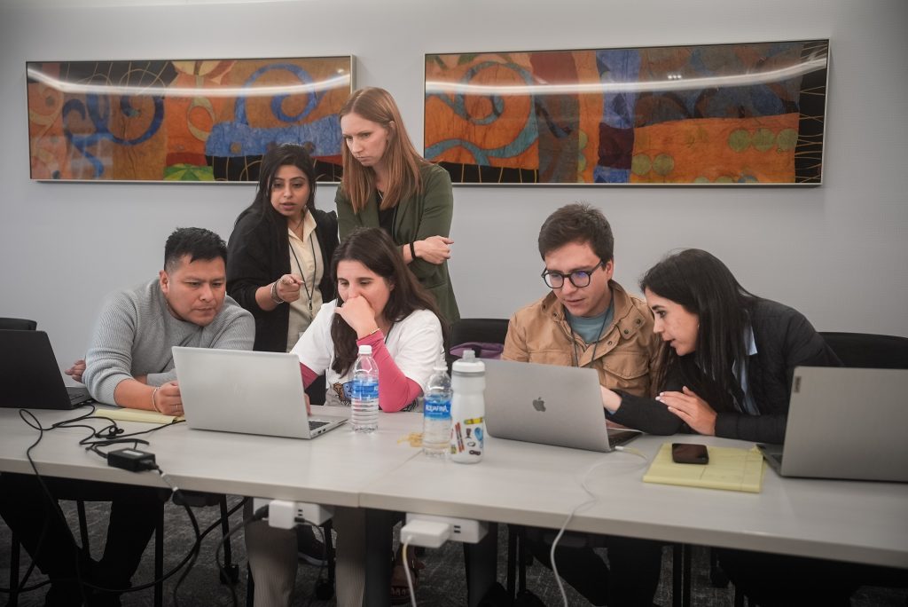 Image of the Undiagnosed Hackathon showing 6 people looking at laptops