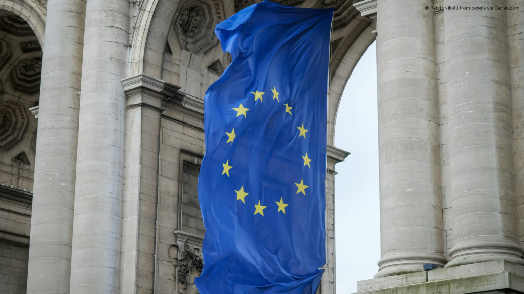 Photo of the EU flag hanging between two columns