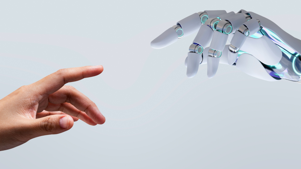 Image of a human hand reaching out to a robotic hand to denote the use of AI